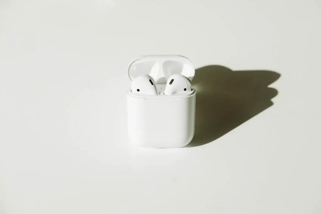 white wireless Bluetooth earbuds with case