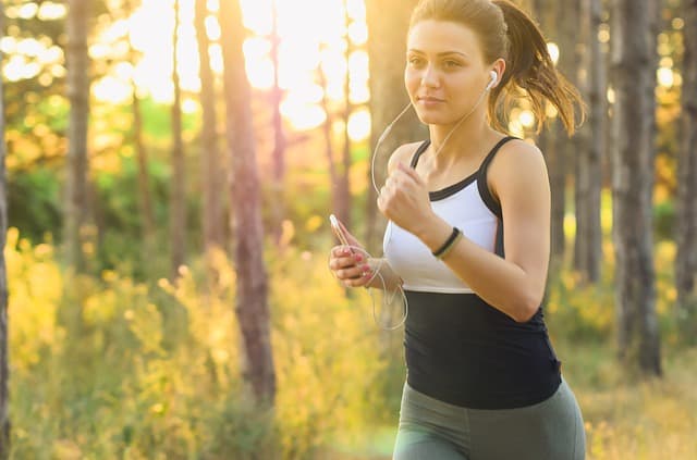 woman wearing earbuds